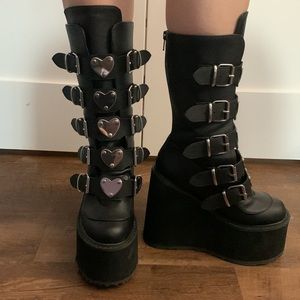 Demonias Black tall platform heart buckle boots